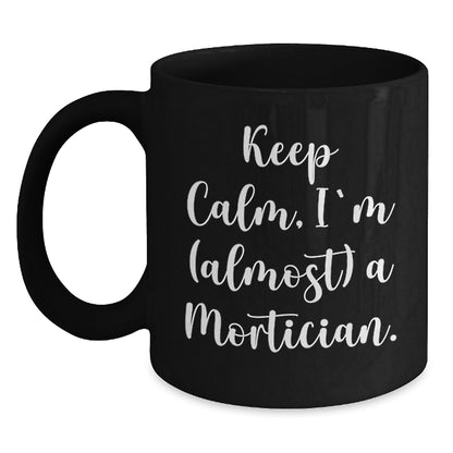 Funny Mortician Gifts, Keep Calm I'm (almost) A Mortician Black Coffee Mug for Christmas, Gifts from Men to Mortician Friends - Main