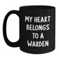 Funny Warden Gifts from Friends Christmas Unique Mug, 'My Heart Belongs To A Warden', Black Coffee Mug for Warden Lover - Main