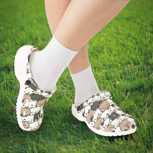 Clogs with bear pattern worn with white socks on a white background