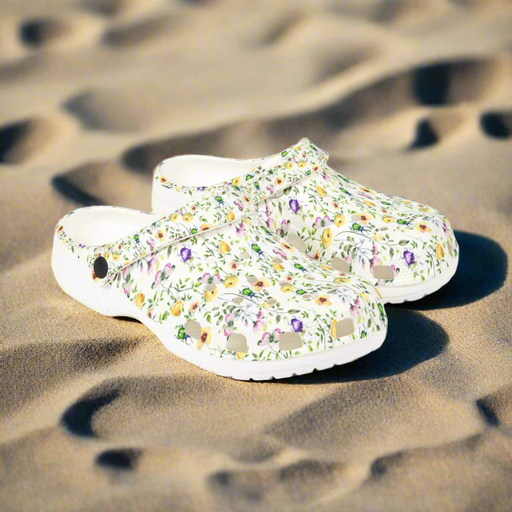 Floral-patterned clogs on a white background