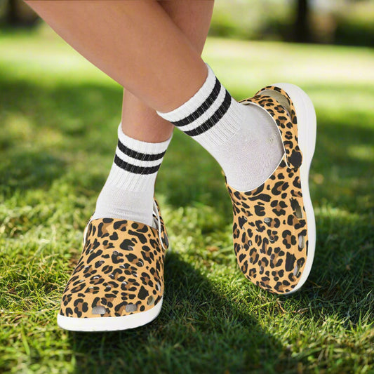 Leopard print slip-on shoes with white socks and black stripes on a white background