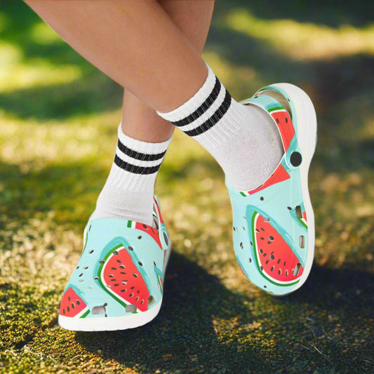 Shoes with watermelon design worn with white socks on a white background