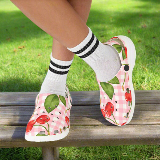 Children's shoes with cherry design on a white background