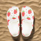 White slippers with strawberry pattern on a white background