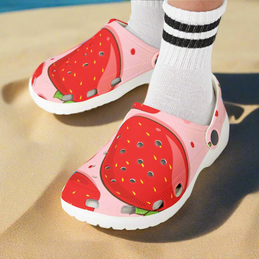 Children's strawberry-themed clogs on a white background
