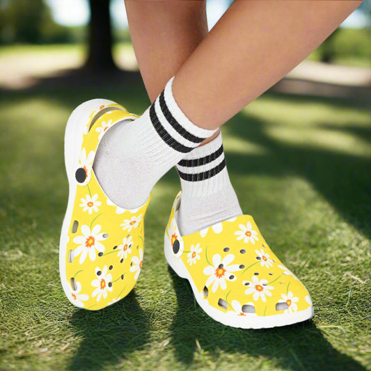 Yellow floral shoes worn with white socks on a white background