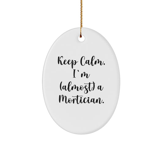 Funny Mortician Oval Ornament, Gifts from Friends for Christmas Unique Gifts with Humor, Keep 'I'm (almost) A Mortician', White Oval Decor, Christmas Tree Decorations - Image 1